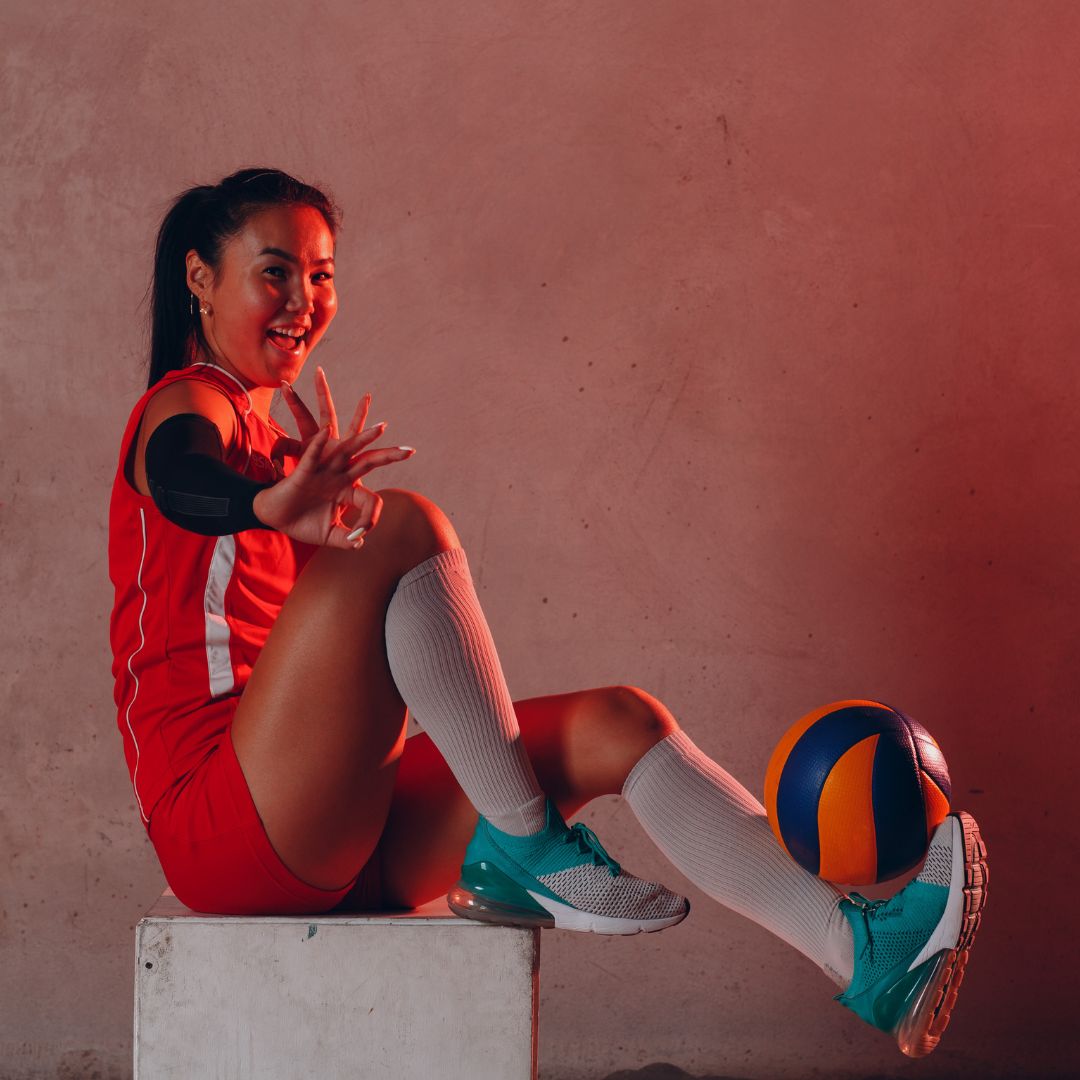 volleyball player balancing ball on foot