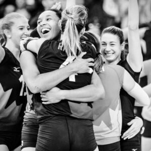 volleyball team hugging