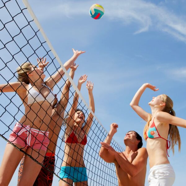 A team playing beach volleyball