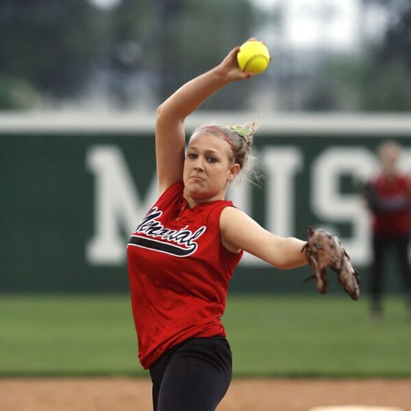 a softball player pitching